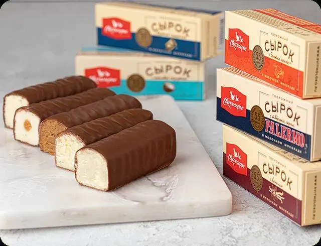 Assorted chocolate-coated sweets with stacked boxed candies for the Russian sweets and cakes section Assorted chocolate-coated sweets with stacked boxed candies for the Russian sweets and cakes section
